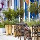 Mediterranean restaurant terrace exterior with chairs. Holiday travel concept.