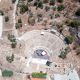 Epidaurus Ancient little Theatre at Argolida, Greece Aerial, drone top down view. Greek monument stone seats theater perfect to acoustic and aesthetic. Archeological destination Unesco Heritage.