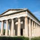 Temple of Hephaestus in Athens, Greece. Sunny view of Ancient Greek ruins in the Athens center. The Famous Hephaistos temple on the Agora in Athens, the capital of Greece.